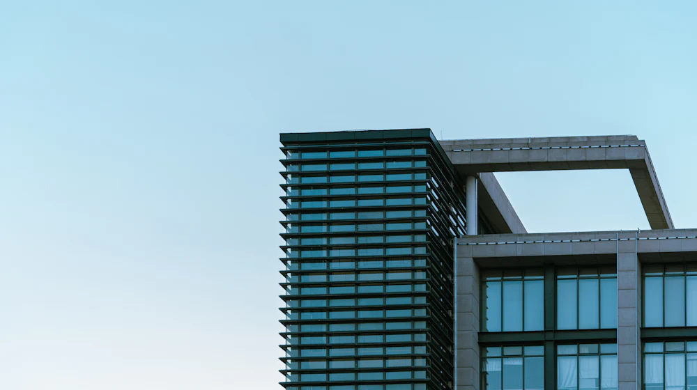 Glass and steel corner of a modern multi-storey office building